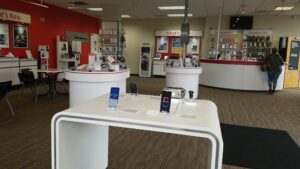 Interior of Kannapolis Verizon store showing display cases of smartphones